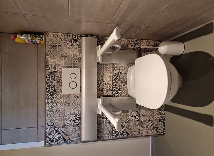 Gemuetliches Wohnzimmer von Anja Hoeve - Sonja, Ferienhaus auf Texel in Den Hoorn, mit komfortabler Sitzecke.