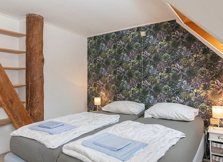 Gemuetliches Wohnzimmer von Rabbit Hole in Den Hoorn Texel mit bequemen Sitzgelegenheiten.