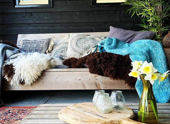 Cozy terrace with fireplace at Holiday home in Oosterend, Texel, ideal for evenings in nature.