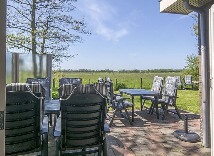 Esszimmer mit Aussicht im Ferienhaus Nieuwlanderweg 69, De Koog, Texel, Waddeninseln.