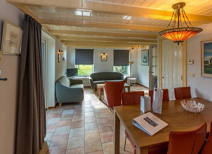 Charming Holiday Home in Oosterend on Texel with thatched roof and green surroundings.