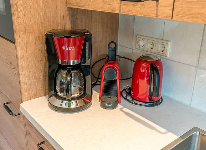 Charming Holiday Home in Oosterend on Texel with thatched roof and green surroundings.