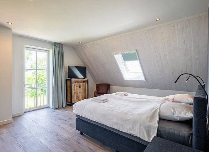 Vakantiehuis in Oosterend, Texel biedt een ruime en uitnodigende leefruimte voor ontspanning.