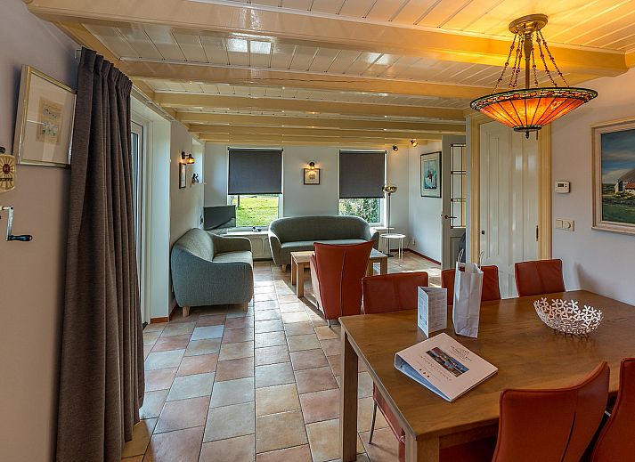 Golden Rider vacation home in Oosterend, Texel with traditional architecture and thatched roof.