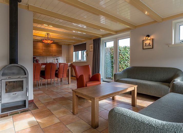 Golden Rider vacation home in Oosterend, Texel with traditional architecture and thatched roof.