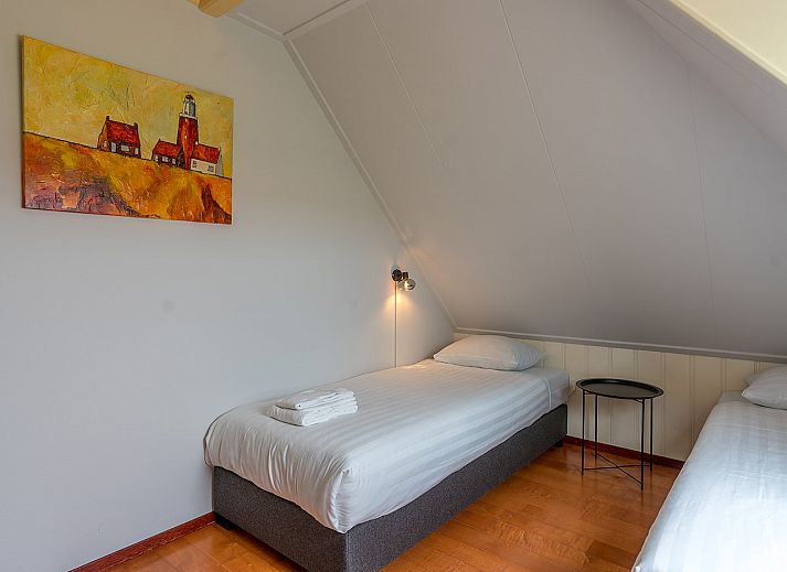Modern living room of Zilverling vacation home in Oosterend, Texel overlooking the terrace.