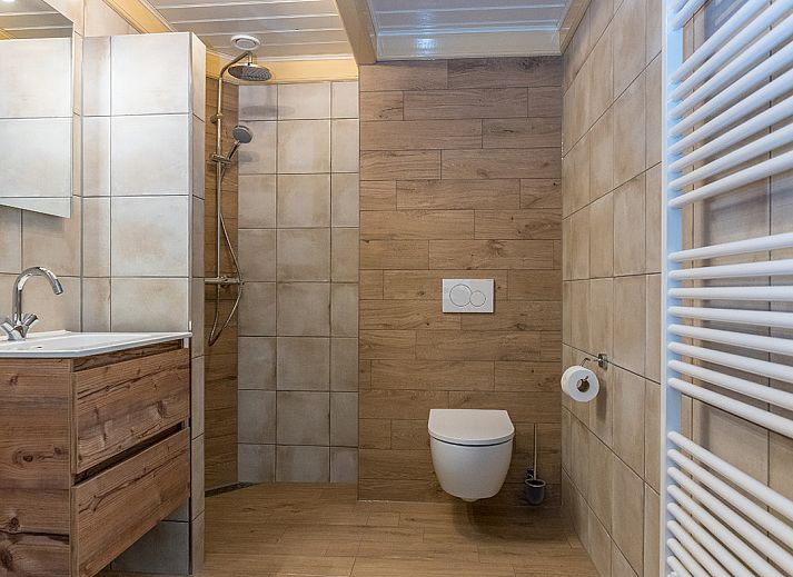 Cozy living room in 13 - Dukaat - allotment, vacation home in Oosterend, Texel, with comfortable seating.