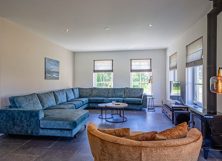 Vakantiehuis 46 - Nieuw Zeeland in Oosterend, Texel, met groene omgeving en zonnige veranda.