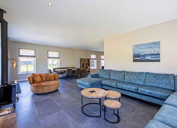 Vakantiehuis 46 - Nieuw Zeeland in Oosterend, Texel, met groene omgeving en zonnige veranda.