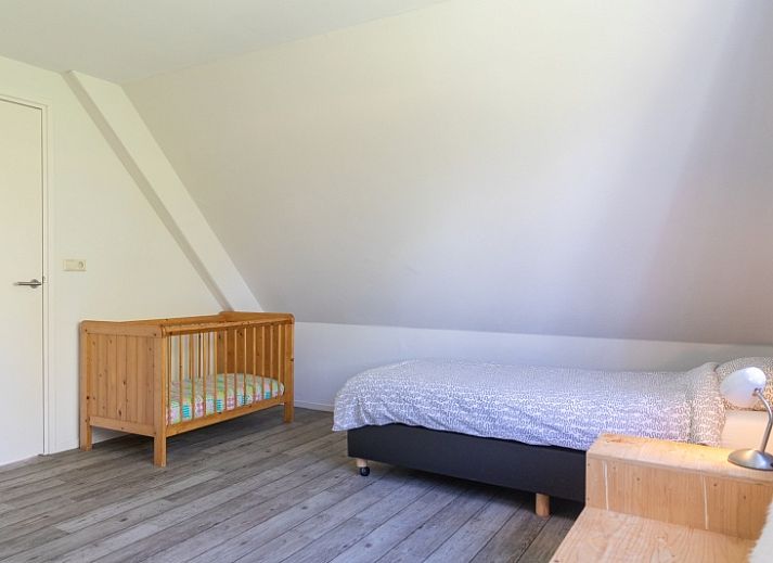 Gemuetliches Wohnzimmer des Ferienhauses Lucrosa in Oosterend Texel mit bequemer Sitzecke.