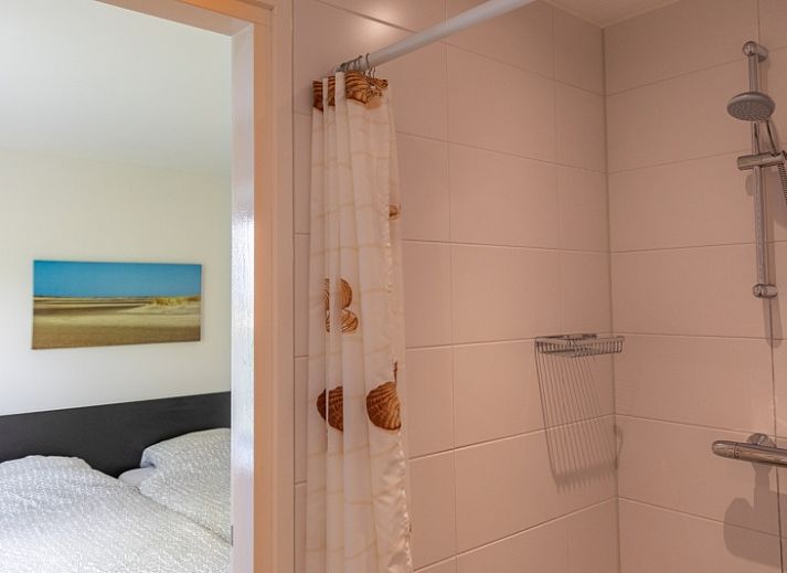 Gemuetliches Wohnzimmer des Ferienhauses Lucrosa in Oosterend Texel mit bequemer Sitzecke.