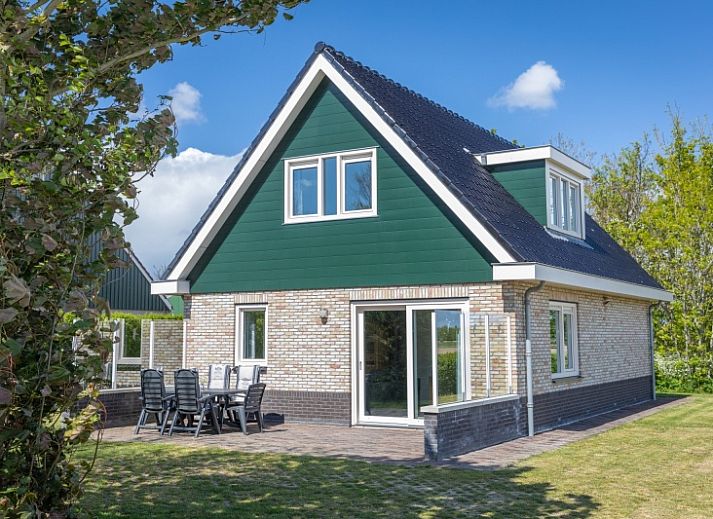 Gemuetliches Wohnzimmer des Ferienhauses Lucrosa in Oosterend Texel mit bequemer Sitzecke.