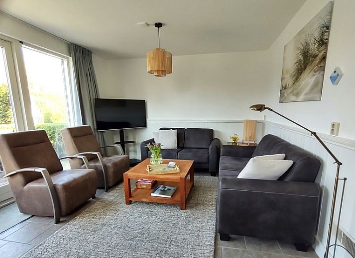 Typ II - Nr. 37 Haus Spatz Ferienhaus in Oosterend, Texel mit schoener Fassade und gruener Umgebung.