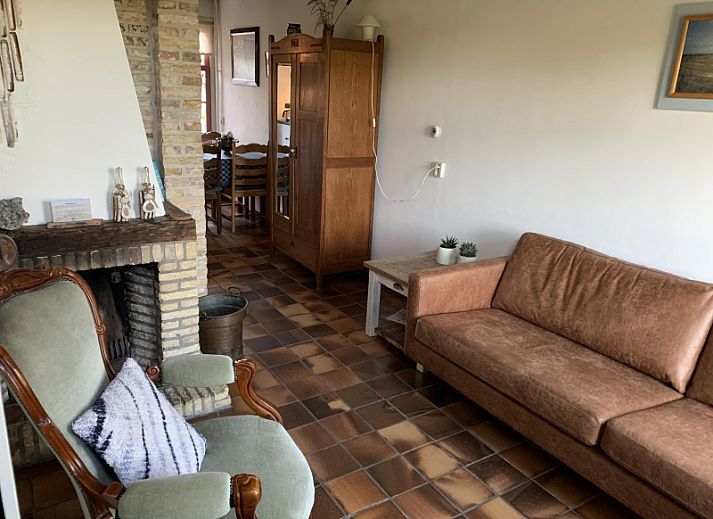 Achterzijde van Vissershuisje De Bruinvis in Oudeschild, Texel, vakantiehuis met zonnige buitenruimte op de Waddeneilanden.