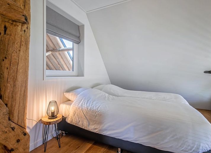 Terrasse von Cottage in Oudeschild, Ferienhaus auf Texel, mit schoener Aussicht auf die Felder.
