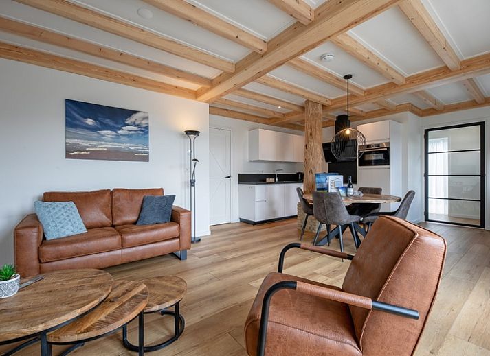 Apartment C in Oudeschild, Texel with charming outdoor space and colorful garden.