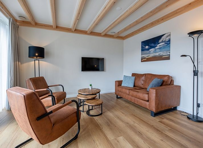 Apartment C in Oudeschild, Texel with charming outdoor space and colorful garden.