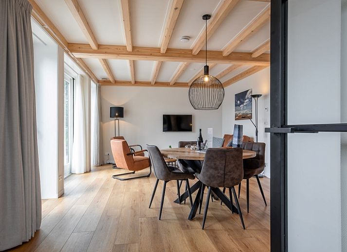 Apartment C in Oudeschild, Texel with charming outdoor space and colorful garden.