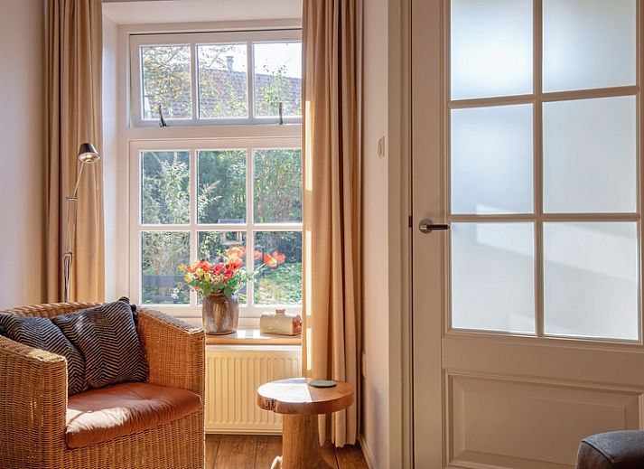 Gezellige buitenkant van Het Bakkerijtje vakantiehuis in Oudeschild, Texel met rustieke uitstraling.