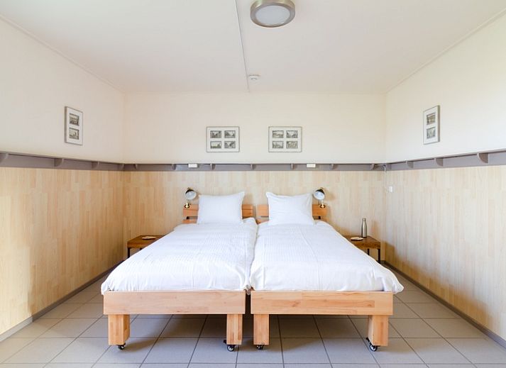 Cozy terrace at De Triaan vacation homes in South Eierland, Texel, perfect for relaxing in nature.