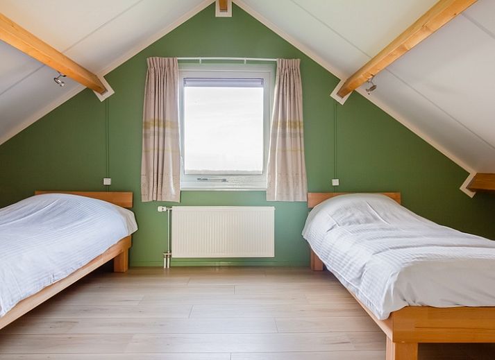 Cozy terrace at De Triaan vacation homes in South Eierland, Texel, perfect for relaxing in nature.