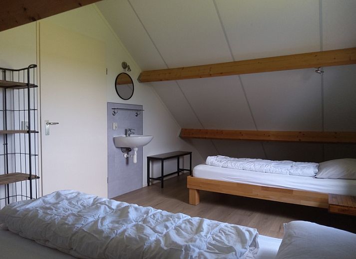 Cozy terrace at De Triaan vacation homes in South Eierland, Texel, perfect for relaxing in nature.