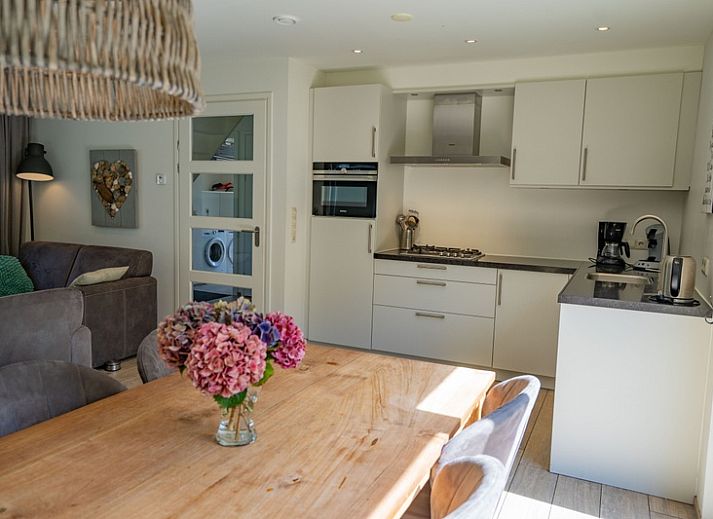 Gemuetliches Wohnzimmer des Ferienhauses de Parel 150 in De Dennen, Texel.