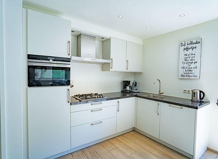 Gemuetliches Wohnzimmer des Ferienhauses de Parel 150 in De Dennen, Texel.