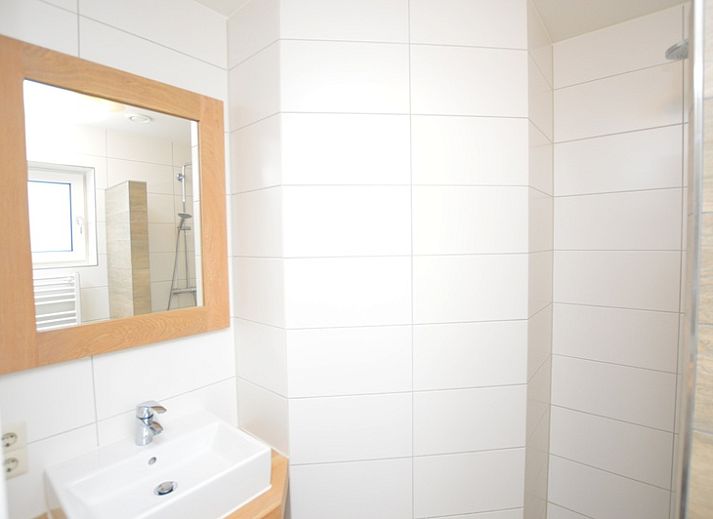 Gemuetliches Wohnzimmer des Ferienhauses de Parel 150 in De Dennen, Texel.