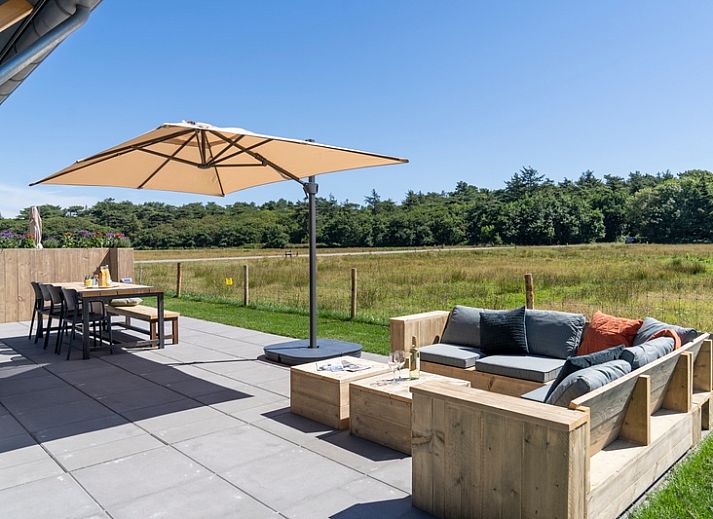 Vacation home 2 in De Dennen, Texel with modern architecture and spacious outdoor space.