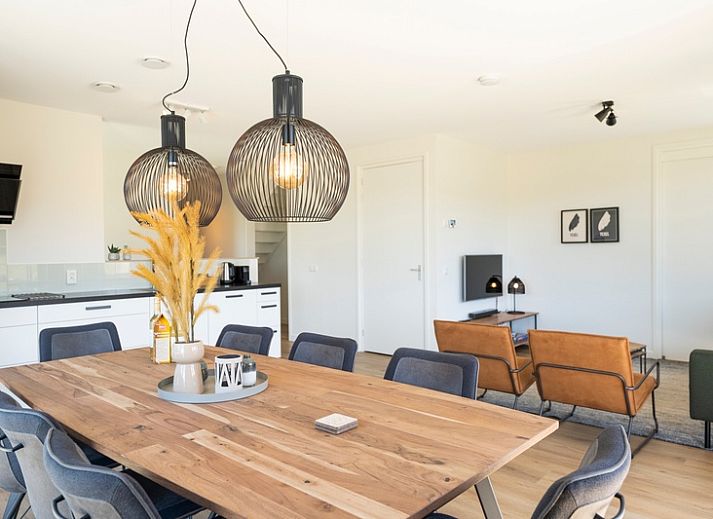 Terrace of Holiday Home 2 in De Dennen, Texel with views of nature and comfortable seating.