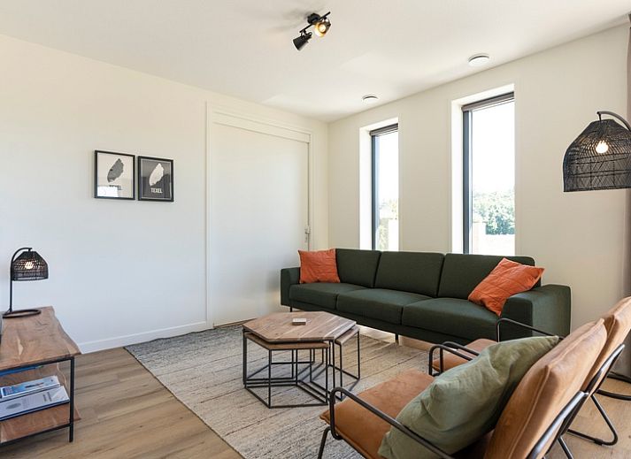 Terrace of Holiday Home 2 in De Dennen, Texel with views of nature and comfortable seating.