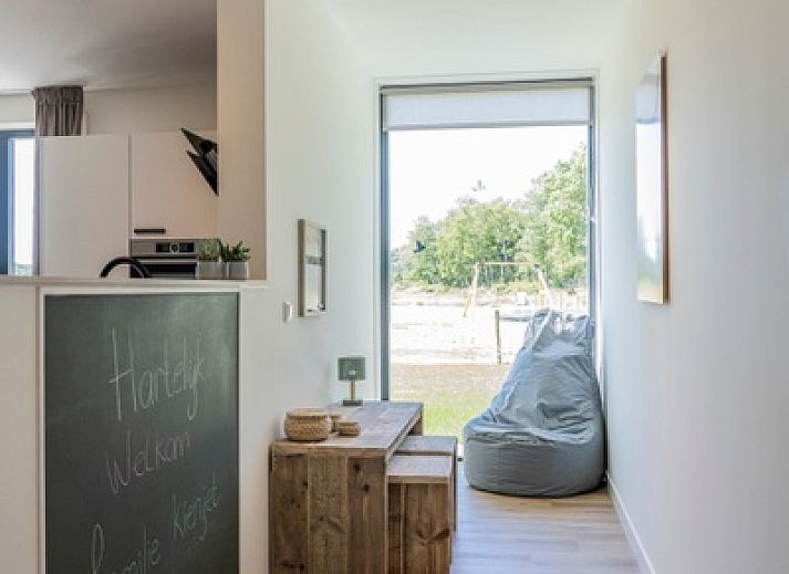 Terrace of Holiday Home 2 in De Dennen, Texel with views of nature and comfortable seating.