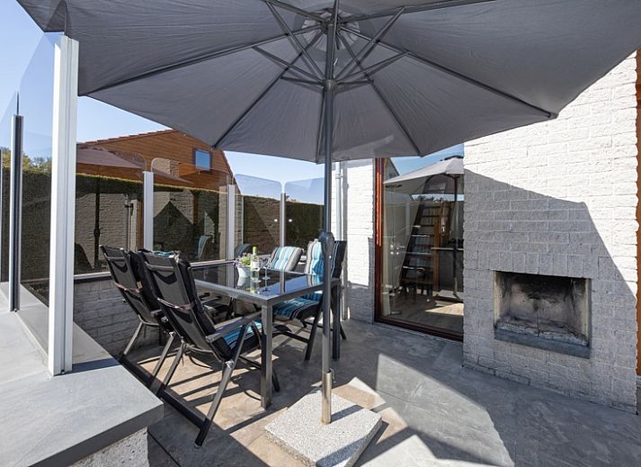 Gezellige woonkamer in Vakantiehuis Gortersmient 214, De Dennen, Texel. Comfortabel verblijf op de Waddeneilanden.