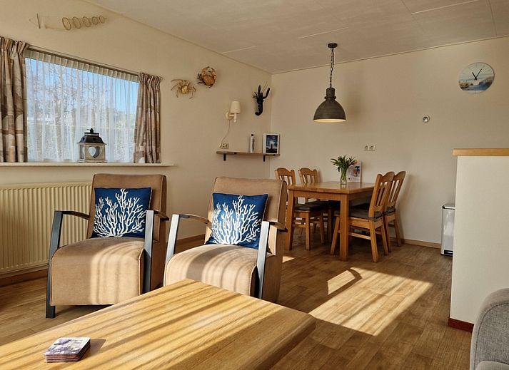 Enjoy the sunny garden at Bungalowpark Uterste Coogh - Bungalow 116 in De Dennen, Texel with comfortable deck chairs.