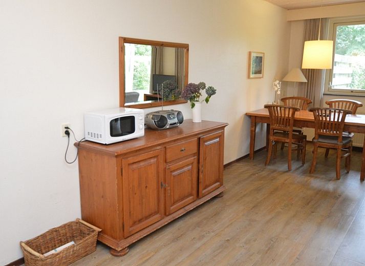 Cozy living room of vacation home Narcis, De Dennen, Texel with comfortable seating area.