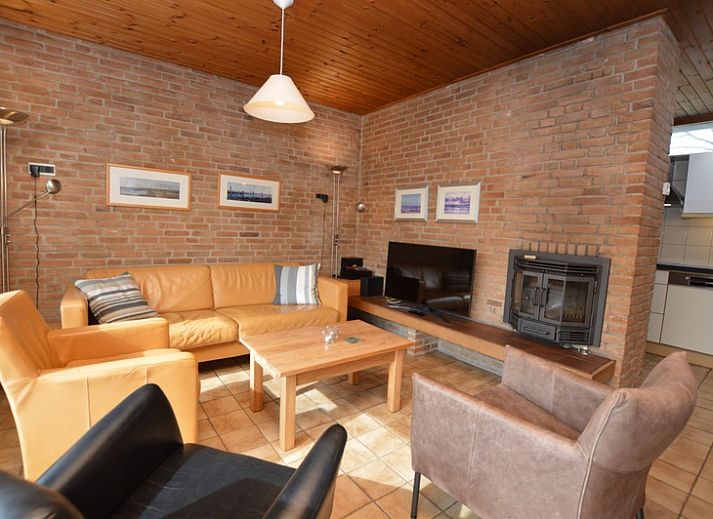 Vacation home de Parel 204 in De Dennen, Texel with sunny terrace and green surroundings.