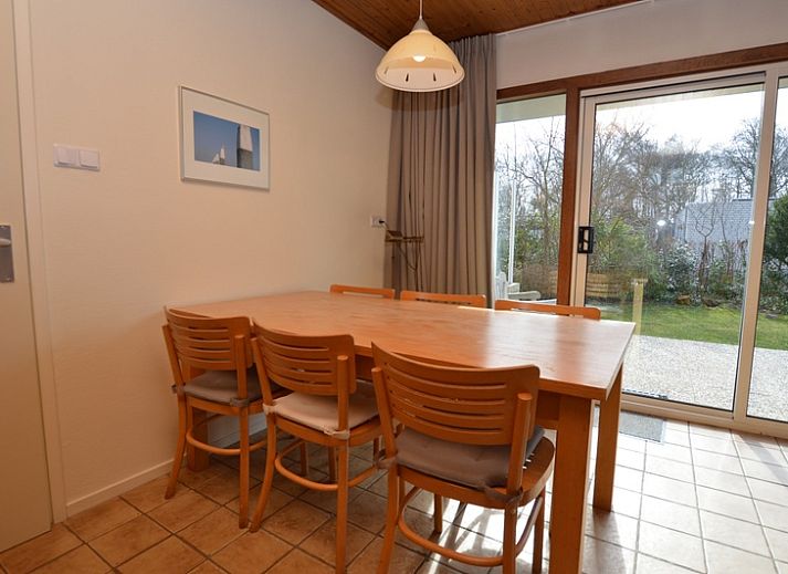 Vacation home de Parel 204 in De Dennen, Texel with sunny terrace and green surroundings.