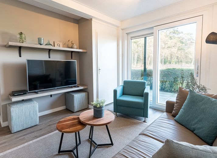 Stylish living room of Apartment Bos en Duin 12 in De Dennen, Texel with modern interior and lots of natural light.