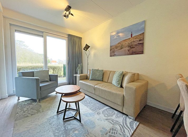 Cozy living room in Apartment Bos en Duin 14, De Dennen, Texel with comfortable seating area and natural light.