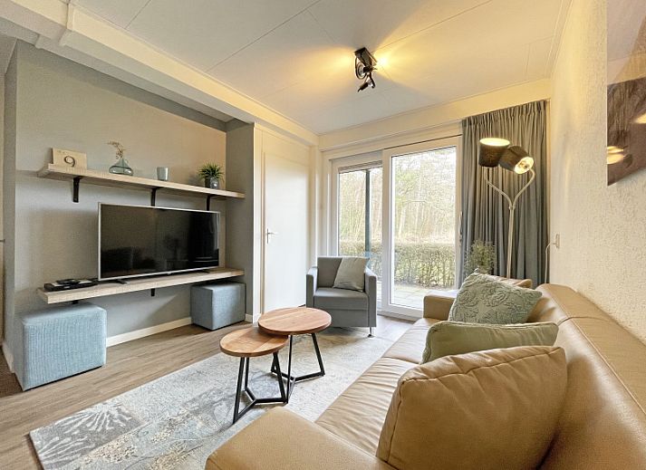 Cozy living room in Apartment Bos en Duin 14, De Dennen, Texel with comfortable seating area and natural light.