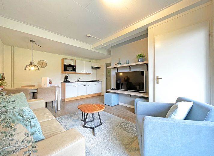 Cozy living room in Apartment Bos en Duin 14, De Dennen, Texel with comfortable seating area and natural light.