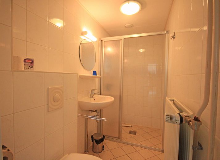 Stylish living area of Apartment Bos en Duin 14, De Dennen, Texel with modern furnishings and dining area.