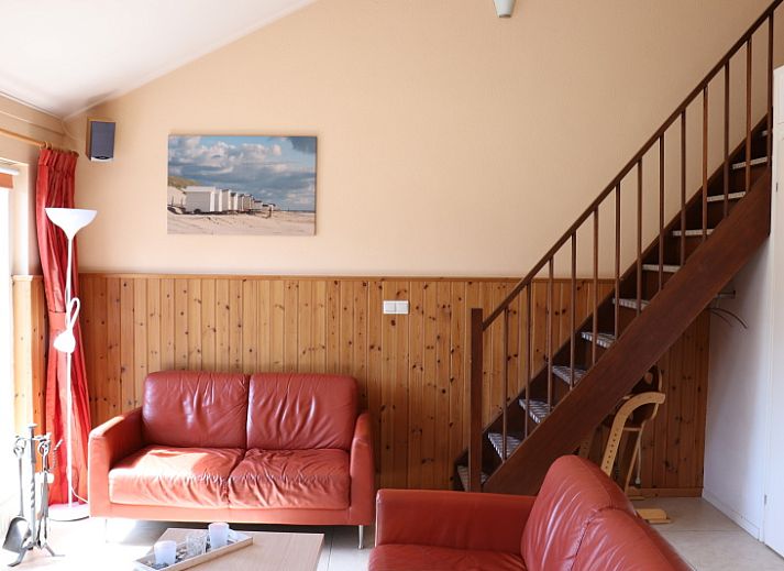 Side view of Holiday home Gortersmient 312 in De Dennen Texel with spacious terrace.