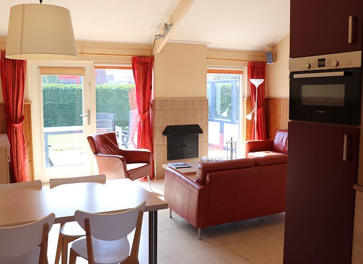 Side view of Holiday home Gortersmient 312 in De Dennen Texel with spacious terrace.