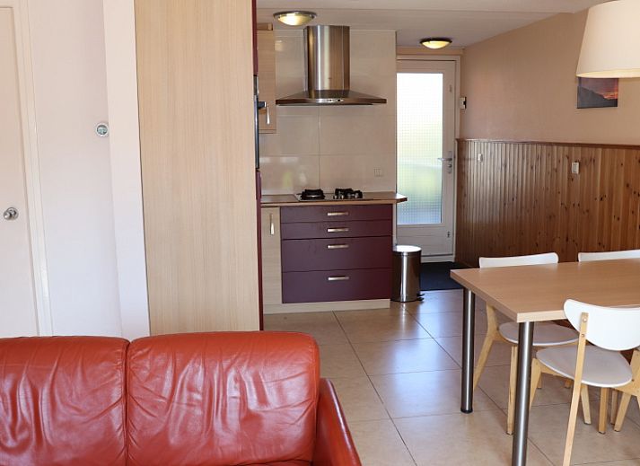 Side view of Holiday home Gortersmient 312 in De Dennen Texel with spacious terrace.