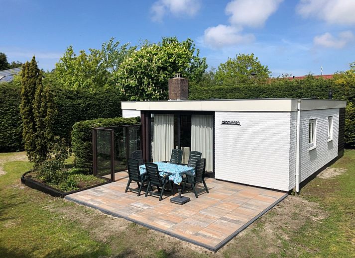 Vacation home de Parel 258 in De Dennen, Texel with sunny terrace and green surroundings.