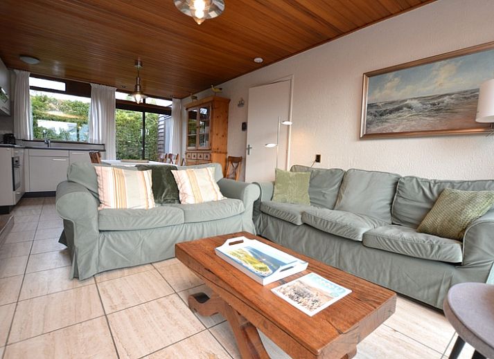 Vacation home de Parel 258 in De Dennen, Texel with sunny terrace and green surroundings.