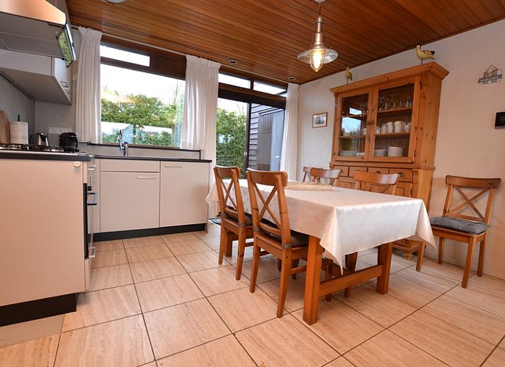 Vacation home de Parel 258 in De Dennen, Texel with sunny terrace and green surroundings.