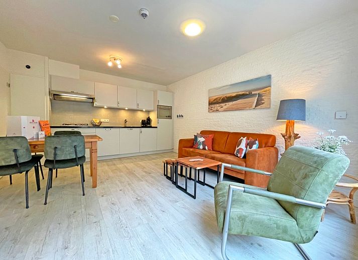 Spacious living room in Apartment Bos en Duin 08, De Dennen, Texel, with modern kitchen and comfortable seating area.